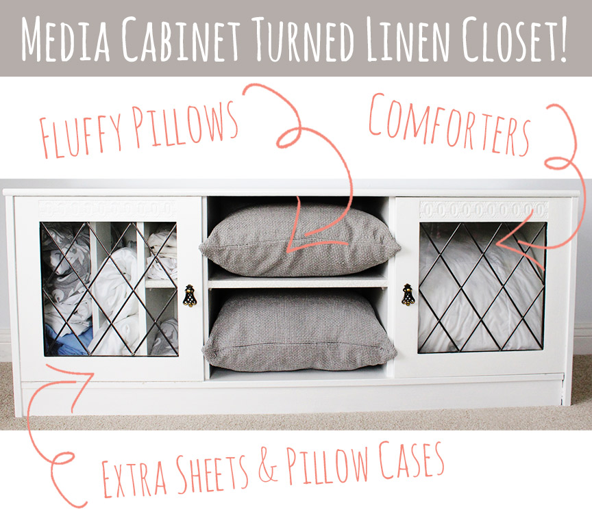 Use a media cabinet as a mini linen closet for guests -- so smart!